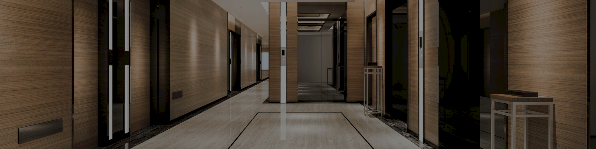A modern, well-lit hallway with wooden walls, reflective floors, and ceiling panels, creating a sleek and sophisticated atmosphere.