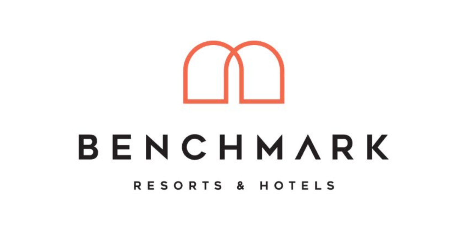 Logo of Benchmark Resorts & Hotels featuring a stylized red arch above the company name in black text.